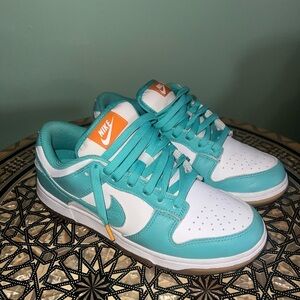 Nike Turquoise and White Sneakers with Orange Accents
